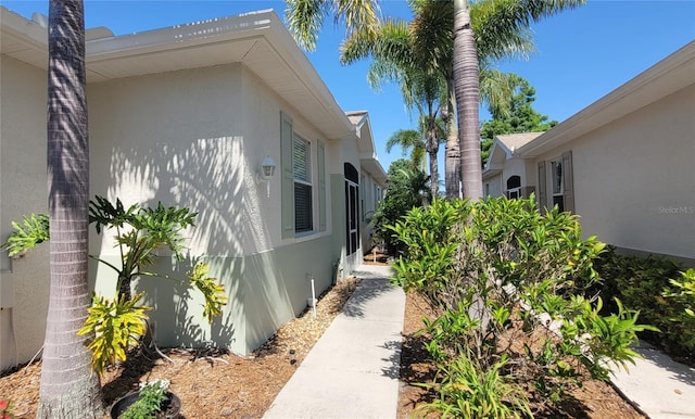 834 Tremont Greens Ln Unit 137, Sun City Center, FL 33573 - view of home's exterior featuring stucco siding