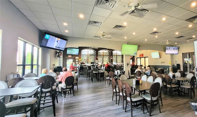 834 Tremont Greens Ln Unit 137, Sun City Center, FL 33573 - dining space with a ceiling fan and wood finished floors