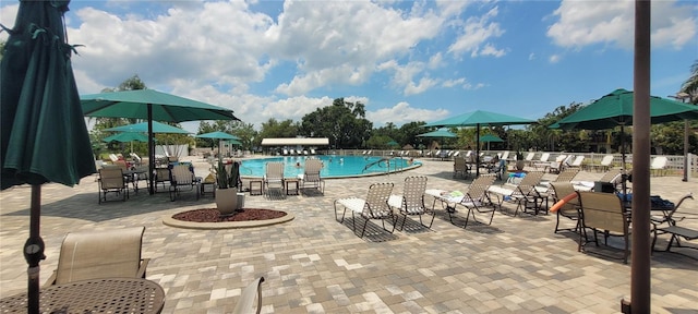 834 Tremont Greens Ln Unit 137, Sun City Center, FL 33573 - community pool featuring a patio