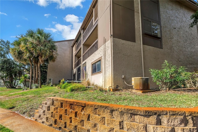 6309 Newtown Cir Unit 9B2, Tampa, FL 33615 - view of building exterior with central air condition unit