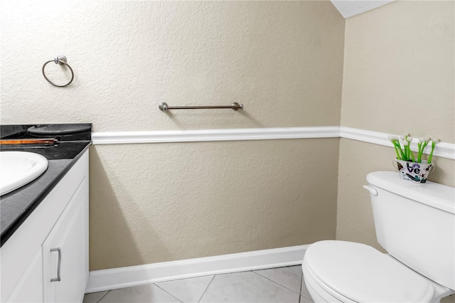 6309 Newtown Cir Unit 9B2, Tampa, FL 33615 - half bath with vanity, toilet, and tile patterned floors