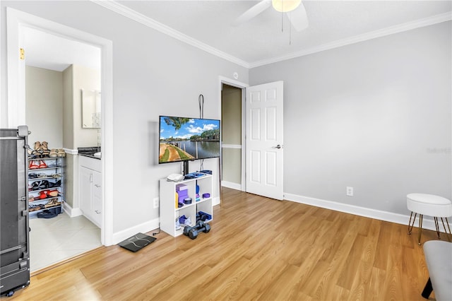 6309 Newtown Cir Unit 9B2, Tampa, FL 33615 - unfurnished room with a ceiling fan, wood finished floors, crown molding, and baseboards