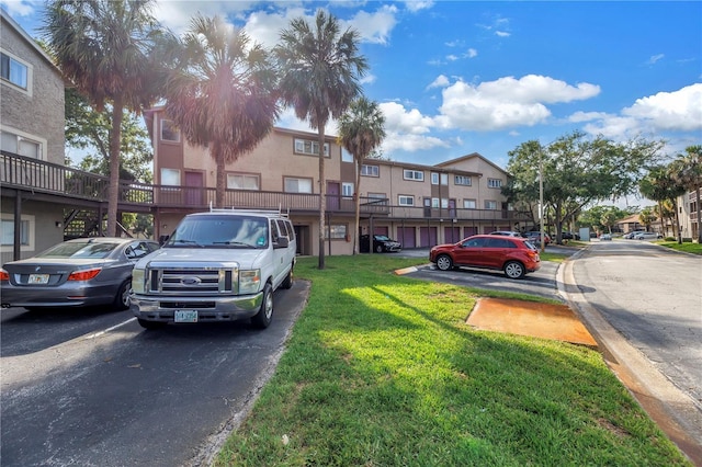6309 Newtown Cir Unit 9B2, Tampa, FL 33615 - view of asphalt road with a residential view and curbs