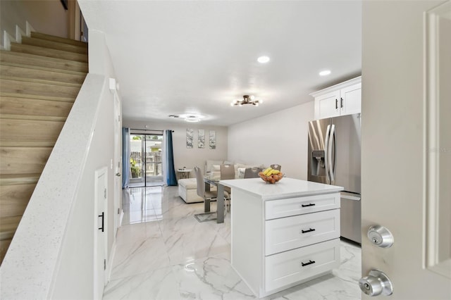 4017 Cedar Limb Ct, Tampa, FL 33614 - kitchen featuring stainless steel fridge, open floor plan, light marble finish flooring, recessed lighting, and light countertops