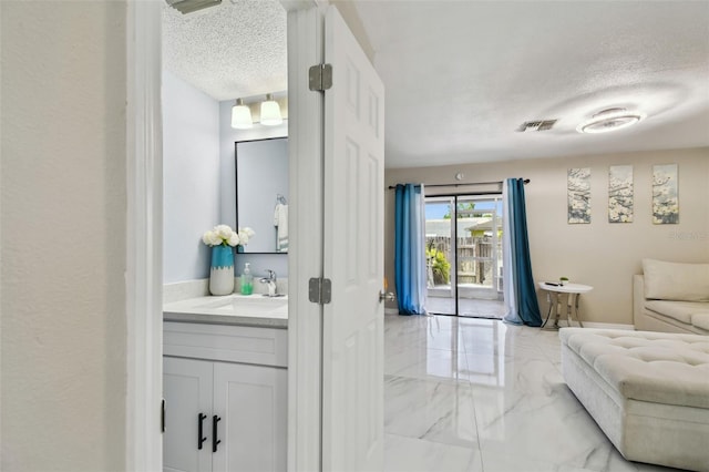 4017 Cedar Limb Ct, Tampa, FL 33614 - living room featuring marble tiled floors and a textured ceiling