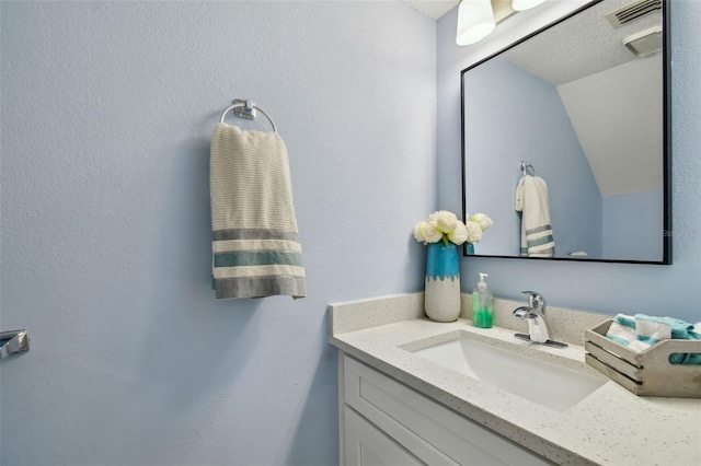 4017 Cedar Limb Ct, Tampa, FL 33614 - bathroom featuring vanity and lofted ceiling