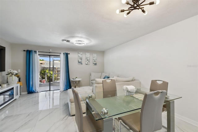 4017 Cedar Limb Ct, Tampa, FL 33614 - dining room featuring light marble finish floors, baseboards, and a chandelier