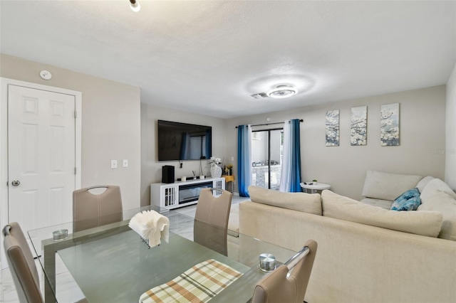 4017 Cedar Limb Ct, Tampa, FL 33614 - dining space featuring a textured ceiling