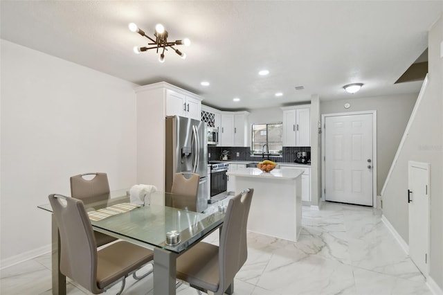 4017 Cedar Limb Ct, Tampa, FL 33614 - dining room featuring baseboards, light marble finish flooring, recessed lighting, and a chandelier