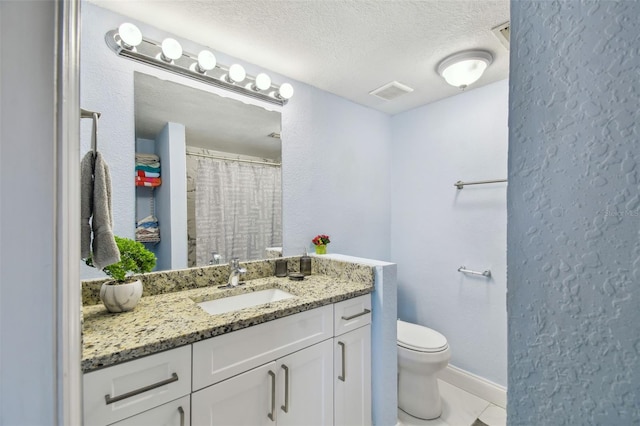 4017 Cedar Limb Ct, Tampa, FL 33614 - full bath with toilet, vanity, a textured ceiling, and a textured wall