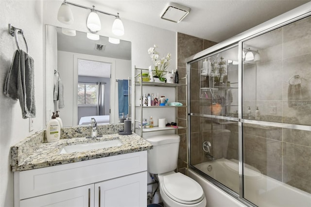 4017 Cedar Limb Ct, Tampa, FL 33614 - bathroom featuring toilet, vanity, and bath / shower combo with glass door