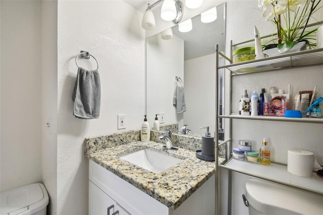 4017 Cedar Limb Ct, Tampa, FL 33614 - half bathroom with toilet, vanity, and a textured wall