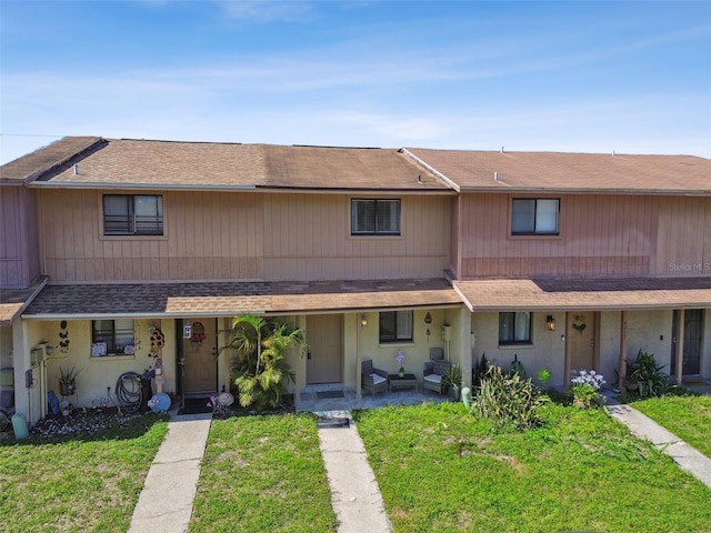 4017 Cedar Limb Ct, Tampa, FL 33614 - townhome / multi-family property featuring a front yard and roof with shingles