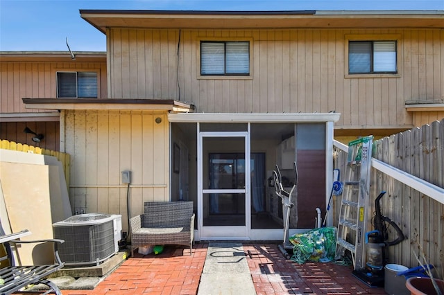 4017 Cedar Limb Ct, Tampa, FL 33614 - view of front of home with central AC unit, a sunroom, and a patio area
