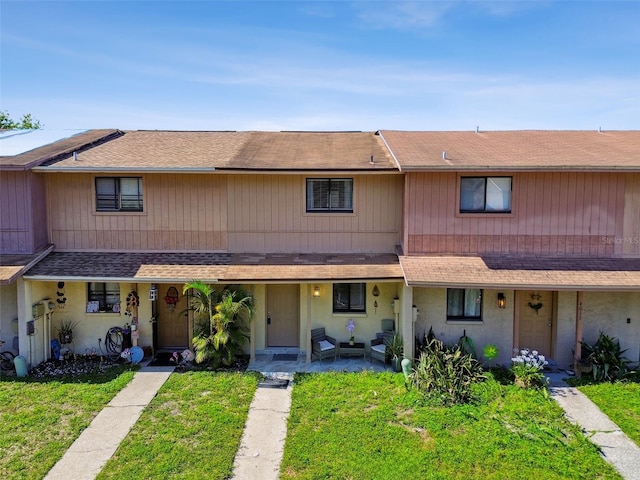 4017 Cedar Limb Ct, Tampa, FL 33614 - view of front of property with a front yard and roof with shingles