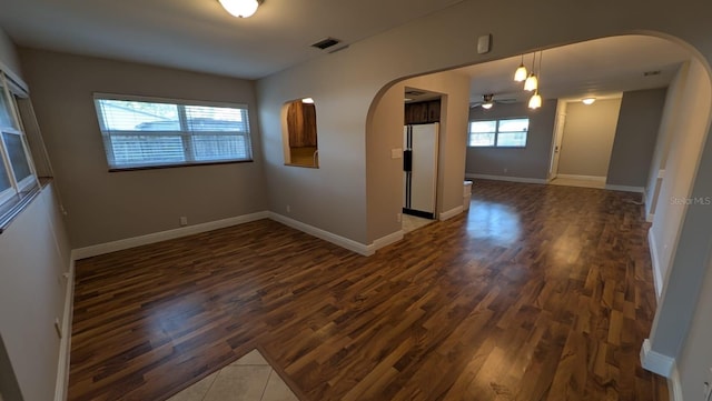 4021 19th St N, Saint Petersburg, FL 33714 - unfurnished room featuring arched walkways and dark wood-style floors
