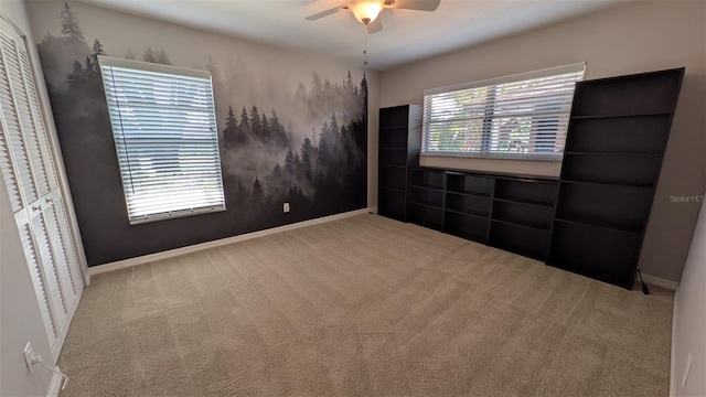 4021 19th St N, Saint Petersburg, FL 33714 - unfurnished bedroom with carpet flooring, baseboards, and ceiling fan