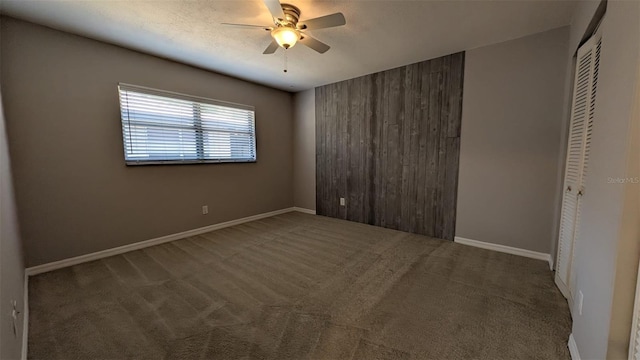 4021 19th St N, Saint Petersburg, FL 33714 - unfurnished bedroom featuring a closet, carpet floors, baseboards, and a ceiling fan