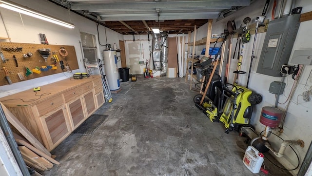 4021 19th St N, Saint Petersburg, FL 33714 - garage featuring a workshop area, water heater, and electric panel