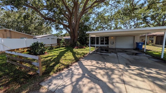 4021 19th St N, Saint Petersburg, FL 33714 - view of front of home featuring driveway, a garage, and a carport