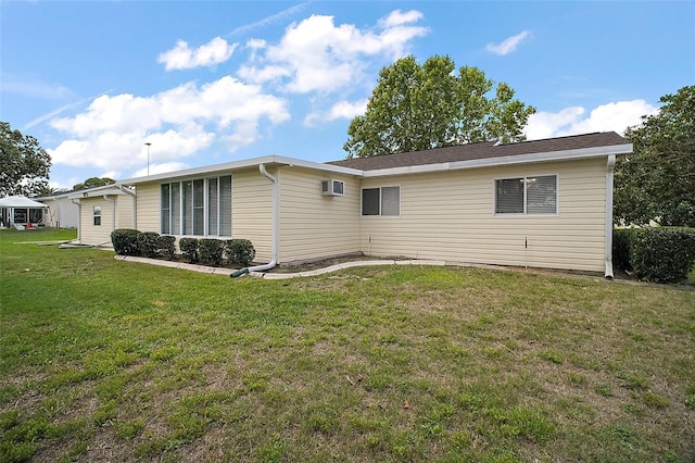 9755 SE 176th St, Summerfield, FL 34491 - back of property featuring a yard and an AC wall unit