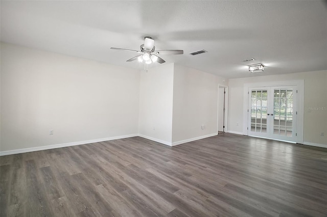 9755 SE 176th St, Summerfield, FL 34491 - spare room with dark wood-type flooring, ceiling fan, baseboards, and french doors