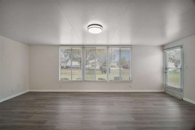 9755 SE 176th St, Summerfield, FL 34491 - unfurnished room with dark wood-style flooring and baseboards