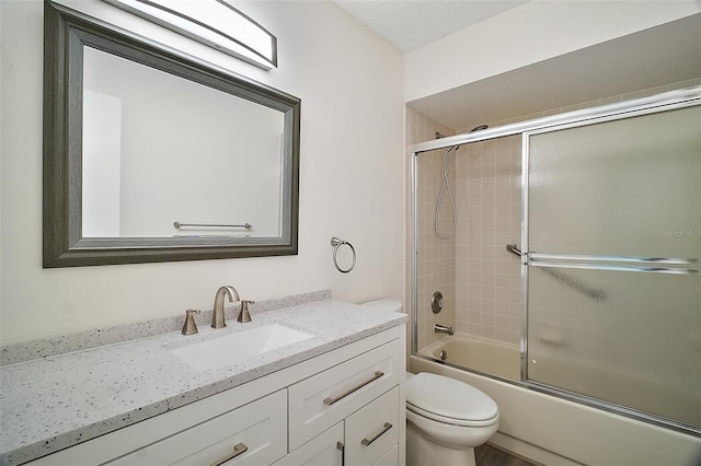 9755 SE 176th St, Summerfield, FL 34491 - bathroom with toilet, vanity, and bath / shower combo with glass door