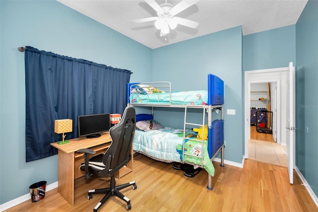 1516 E Lake Woodlands Pkwy, Oldsmar, FL 34677 - bedroom with wood finished floors, baseboards, ceiling fan, and a desk