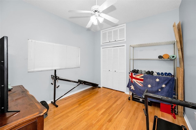 1516 E Lake Woodlands Pkwy, Oldsmar, FL 34677 - workout area featuring wood finished floors, a ceiling fan, and baseboards