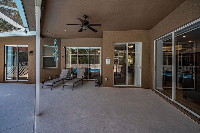 1516 E Lake Woodlands Pkwy, Oldsmar, FL 34677 - view of patio / terrace with a ceiling fan and glass enclosure