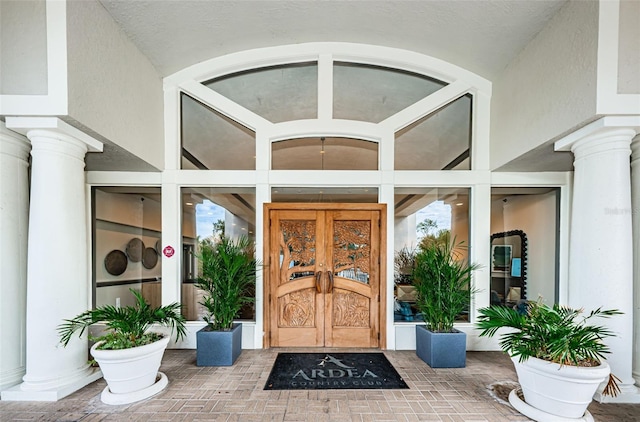 1516 E Lake Woodlands Pkwy, Oldsmar, FL 34677 - entrance to property with french doors and stucco siding