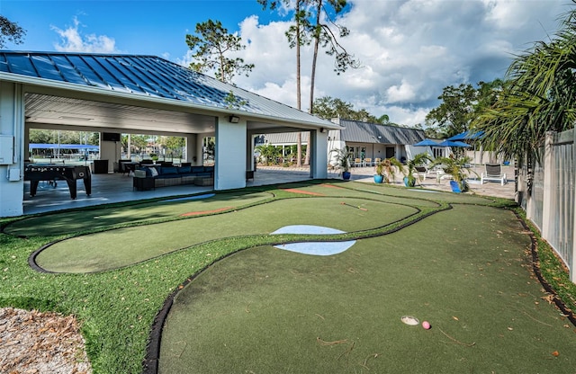 1516 E Lake Woodlands Pkwy, Oldsmar, FL 34677 - view of community featuring a putting area and a patio