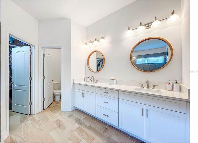 12010 Jackson Landing Pl, Tampa, FL 33624 - full bathroom with double vanity and toilet