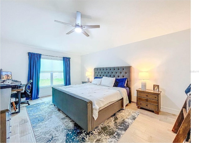 12010 Jackson Landing Pl, Tampa, FL 33624 - bedroom featuring ceiling fan, baseboards, an office area, and light wood-type flooring