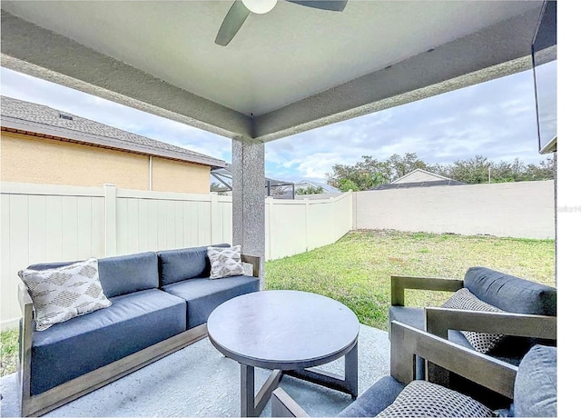 12010 Jackson Landing Pl, Tampa, FL 33624 - view of patio with an outdoor living space and a ceiling fan