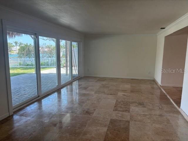 12055 4th St E, Treasure Island, FL 33706 - empty room featuring baseboards and ornamental molding