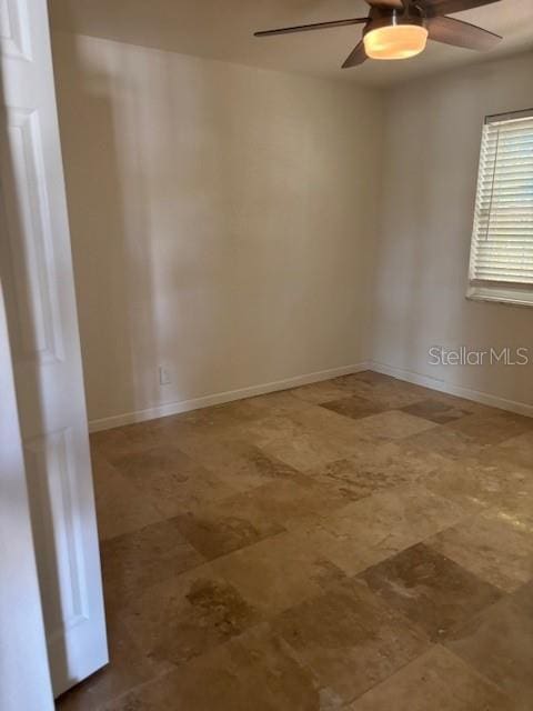12055 4th St E, Treasure Island, FL 33706 - unfurnished room featuring ceiling fan and baseboards