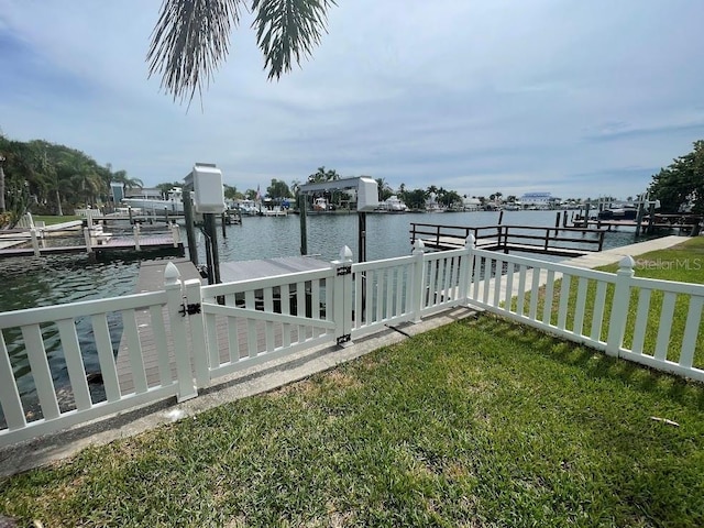12055 4th St E, Treasure Island, FL 33706 - dock with a water view, a yard, and boat lift