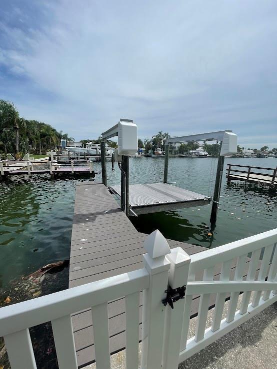 12055 4th St E, Treasure Island, FL 33706 - dock featuring a water view