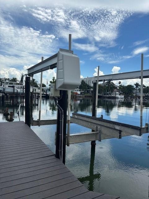 12055 4th St E, Treasure Island, FL 33706 - dock area with boat lift and a water view