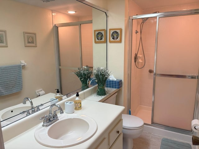 303 Meadow Ln, Oldsmar, FL 34677 - bathroom featuring a stall shower, toilet, vanity, and tile patterned floors