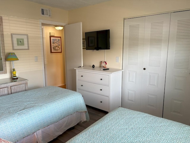 303 Meadow Ln, Oldsmar, FL 34677 - bedroom featuring dark wood-type flooring and a closet