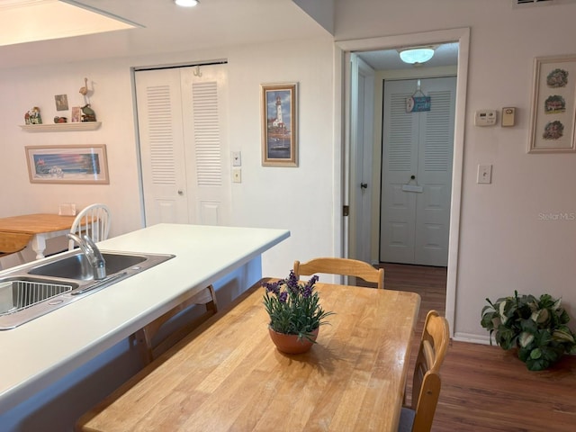 303 Meadow Ln, Oldsmar, FL 34677 - dining room featuring wood finished floors and baseboards