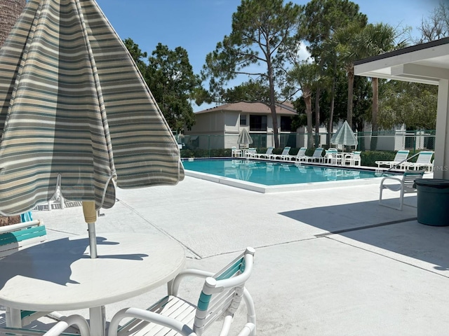 303 Meadow Ln, Oldsmar, FL 34677 - community pool featuring a patio area