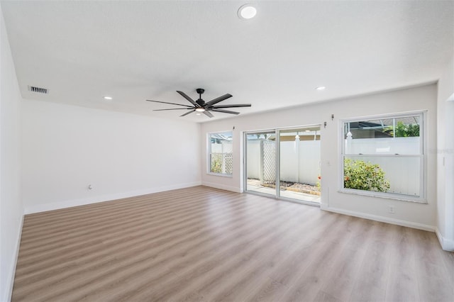 7607 22nd Ave W, Bradenton, FL 34209 - empty room with plenty of natural light, light wood finished floors, baseboards, and recessed lighting