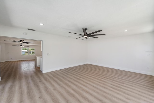 7607 22nd Ave W, Bradenton, FL 34209 - unfurnished room with ceiling fan, recessed lighting, baseboards, and light wood-type flooring