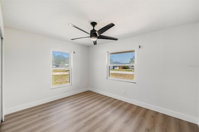 7607 22nd Ave W, Bradenton, FL 34209 - unfurnished room with light wood-style floors, baseboards, and ceiling fan