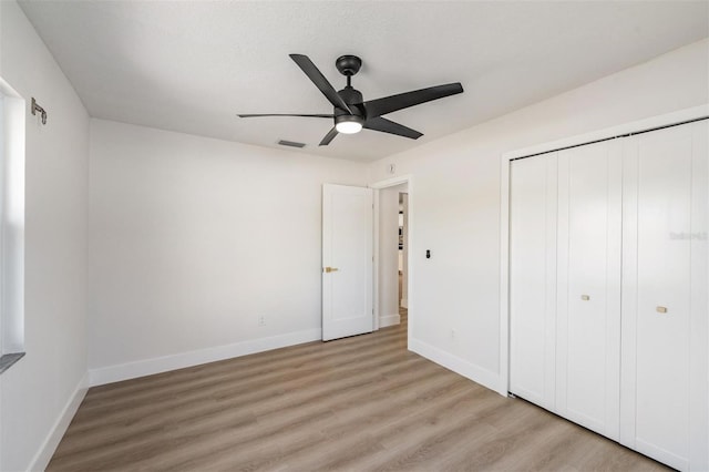 7607 22nd Ave W, Bradenton, FL 34209 - unfurnished bedroom featuring light wood-style flooring, baseboards, and a closet