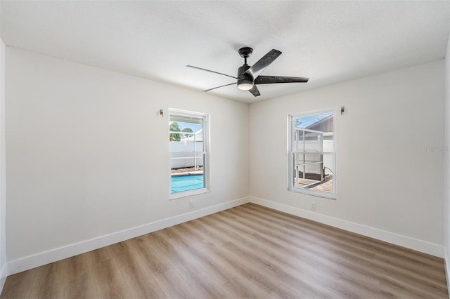 7607 22nd Ave W, Bradenton, FL 34209 - empty room featuring light wood-style floors, ceiling fan, and baseboards